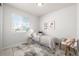 Bright bedroom with natural light, neutral walls and carpet at 7202 S Valleyhead Ct, Aurora, CO 80016