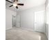 Bedroom with neutral walls, carpet, and ample closet space at 7202 S Valleyhead Ct, Aurora, CO 80016