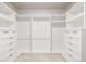 Walk-in closet with custom shelving and drawers for optimal organization at 7202 S Valleyhead Ct, Aurora, CO 80016