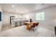 This dining area features a modern table, stylish chairs, and seamless access to the kitchen area at 7202 S Valleyhead Ct, Aurora, CO 80016