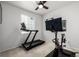 Home gym with treadmill and cycling equipment for convenient workouts at 7202 S Valleyhead Ct, Aurora, CO 80016