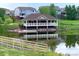 View of lakeside patio with dock at 7202 S Valleyhead Ct, Aurora, CO 80016