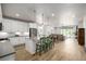 Modern kitchen featuring stainless steel appliances, white cabinets, and an open floorplan at 7202 S Valleyhead Ct, Aurora, CO 80016