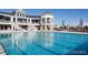 Beautiful pool view showcasing the clear, refreshing water and nearby building at 7202 S Valleyhead Ct, Aurora, CO 80016