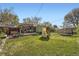 Expansive backyard featuring a patio, playhouse, trampoline, and plenty of space to enjoy outdoor living at 1465 S Urban Way, Lakewood, CO 80228