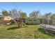 Spacious backyard with a playhouse, trampoline, patio and lush greenery, perfect for Gathering fun at 1465 S Urban Way, Lakewood, CO 80228