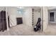 Spacious basement featuring neutral carpeting, built-in shelves, and ample storage space at 1465 S Urban Way, Lakewood, CO 80228
