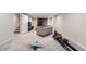 Basement area with workout equipment and seating, perfect for an active lifestyle and relaxation at 1465 S Urban Way, Lakewood, CO 80228