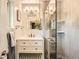 Modern bathroom featuring a tiled walk-in shower and sleek vanity at 1465 S Urban Way, Lakewood, CO 80228