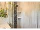 Close up of modern shower with gray tiling and plant at 1465 S Urban Way, Lakewood, CO 80228