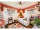 Charming bedroom with hardwood floors, natural light and fun decor at 1465 S Urban Way, Lakewood, CO 80228