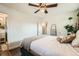 Bright bedroom featuring wood floors, white walls, and access to bathroom at 1465 S Urban Way, Lakewood, CO 80228