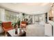 Open living room with skylight, large windows, access to deck and neutral carpet at 1465 S Urban Way, Lakewood, CO 80228