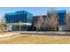 Modern building exterior featuring blue glass and a landscaped courtyard at 1317 N Alton St, Aurora, CO 80010