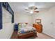 Bedroom featuring a ceiling fan, window with blinds, wooden dresser and a colorful quilt on the bed at 8731 W 89Th Pl, Broomfield, CO 80021