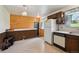 Functional kitchen featuring dark cabinets, and ample counter space at 8731 W 89Th Pl, Broomfield, CO 80021