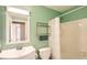 Bright bathroom featuring white fixtures, including a sink, toilet, shower and bathtub at 10511 W 101St Ave, Broomfield, CO 80021