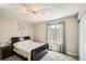 This bedroom features neutral walls, soft carpet, and a window with lots of natural light at 10511 W 101St Ave, Broomfield, CO 80021