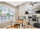 Inviting dining area with natural light, hardwood floors, and views of the loft at 10511 W 101St Ave, Broomfield, CO 80021