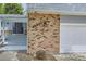 A close-up view of the front entrance of the home showing the address and attached garage at 10511 W 101St Ave, Broomfield, CO 80021