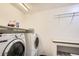 Laundry room featuring a washer, dryer and ample shelving for storage of supplies at 10511 W 101St Ave, Broomfield, CO 80021