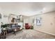 Spacious living room with lots of natural light, neutral carpet, and comfortable seating at 10511 W 101St Ave, Broomfield, CO 80021