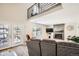 Comfortable living room with fireplace, french doors, and an open layout at 10511 W 101St Ave, Broomfield, CO 80021