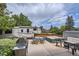 Outdoor patio with grill, table, seating, hot tub, and RV parking at 10511 W 101St Ave, Broomfield, CO 80021