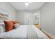 Bright bedroom with hardwood floors and ceiling fan showing view to another room at 1312 Ash St, Denver, CO 80220