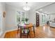 Bright dining area with hardwood floors features a modern light fixture and natural light at 1312 Ash St, Denver, CO 80220