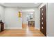 Inviting entryway leads to a dining area with hardwood floors and neutral wall color at 1312 Ash St, Denver, CO 80220
