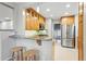 Modern kitchen boasts granite countertops, stainless steel appliances, and custom cabinetry at 1312 Ash St, Denver, CO 80220