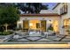 Luxurious backyard patio with modern seating, a fire pit, and manicured landscaping for elegant outdoor living at 181 Race St, Denver, CO 80206