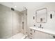Modern bathroom showcasing a walk-in shower, sleek vanity, and contemporary mirror, creating a clean and stylish design at 181 Race St, Denver, CO 80206