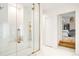 Modern bathroom featuring a tiled glass shower with gold hardware, and access to the bedroom at 181 Race St, Denver, CO 80206