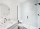 Modern bathroom with a glass-enclosed shower, sleek fixtures, and elegant tile work for a spa-like experience at 181 Race St, Denver, CO 80206