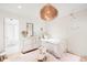 Charming bedroom featuring a quaint bed, soft textures, and delicate decor, creating a peaceful and inviting Bedroom at 181 Race St, Denver, CO 80206
