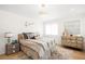 Cozy bedroom featuring a comfortable bed, stylish decor, and a decorative dresser at 181 Race St, Denver, CO 80206