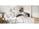 Bright and airy bedroom with french doors, a desk and stylish furnishings at 181 Race St, Denver, CO 80206