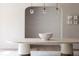 Minimalist dining room with light walls, three hanging lights above a large table at 181 Race St, Denver, CO 80206