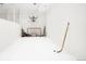 Spacious game room with hockey net and basketball hoop for fun and entertainment in an all-white setting at 181 Race St, Denver, CO 80206