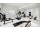 Well-equipped gym featuring treadmills, weights, and mirrored walls for a complete fitness experience at 181 Race St, Denver, CO 80206