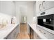 Modern kitchen with marble countertops, stainless steel appliances and gold hardware at 181 Race St, Denver, CO 80206