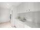 Bright laundry room with modern appliances, ample counter space, and stylish cabinetry for convenient chores at 181 Race St, Denver, CO 80206