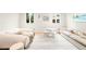 Bright living room with plush sofas, a cozy rug, and ample natural light, creating a comfortable and inviting gathering space at 181 Race St, Denver, CO 80206