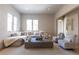 Spacious living room with ample seating, neutral tones, and natural light at 181 Race St, Denver, CO 80206