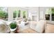 Bright living room with large windows, stylish decor, a fireplace and modern furnishings at 181 Race St, Denver, CO 80206