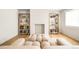 Bright living room featuring built-in bookshelves, a cozy fireplace, and modern furnishings at 181 Race St, Denver, CO 80206