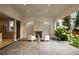 Serene outdoor space with a stone fireplace, comfortable seating, and lush greenery for relaxing and entertaining at 181 Race St, Denver, CO 80206
