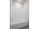 Clean bathroom featuring a shower tub, neutral paint, and simple fixtures at 350 High Point Dr # C201, Longmont, CO 80504